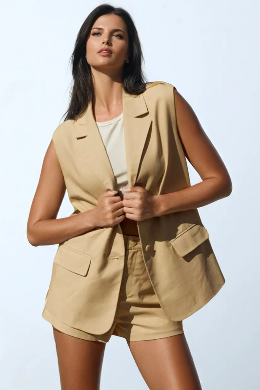 a woman in a tan blazer and shorts 1024