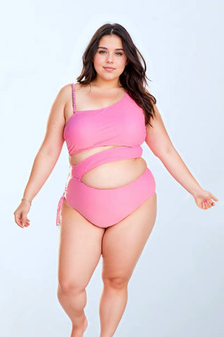 a woman in a pink one piece swimsuit