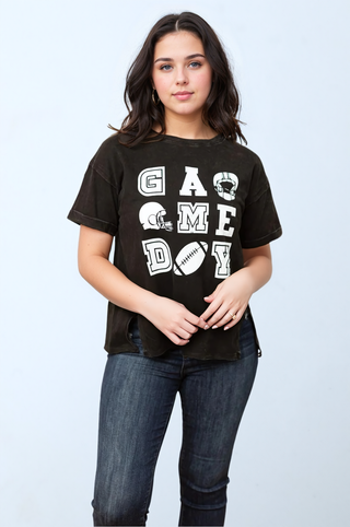 a woman wearing a black shirt with the word game on it