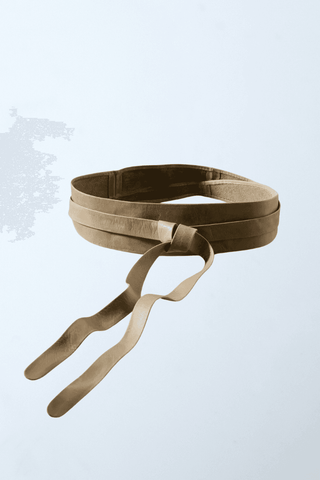 a pair of beige leather straps hanging from a hook