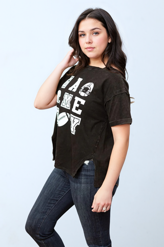 a woman posing for a picture wearing a black shirt