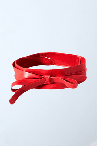 a close up of a red leather belt