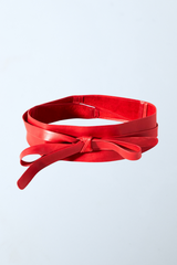 a close up of a red leather belt